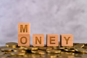 money-word-alphabet-wooden-cube-letters-placed-gold-coin
